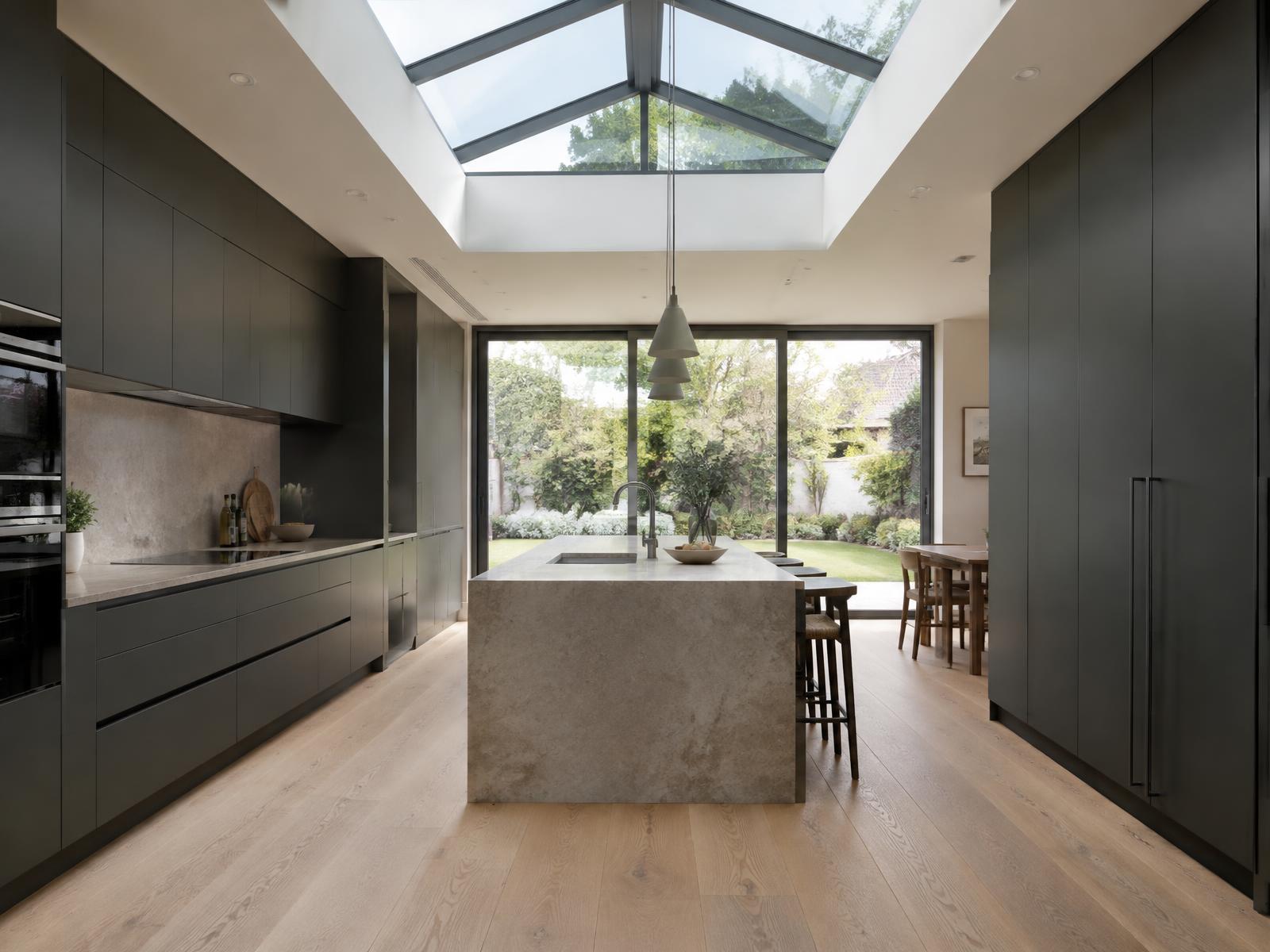 Kitchen extension with roof lantern and stone island